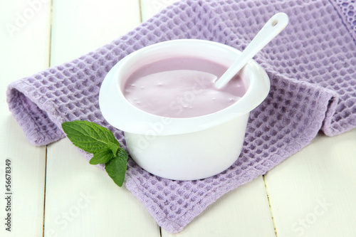 Photo: Delicious yogurt on table close-up Delicious yogurt on table close-up