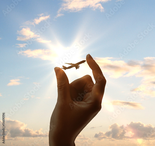 Photo: hand holding airplane hand holding airplane