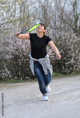 Photo: Attractive woman playing badminton Attractive woman playing badminton