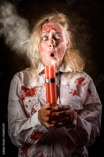 Photo: Funny monster woman with bomb. Halloween countdown Funny monster woman with bomb. Halloween countdown