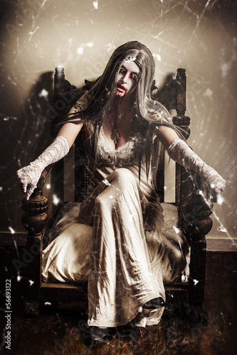 Photo: Haunting horror scene with a strange vampire girl Haunting horror scene with a strange vampire girl