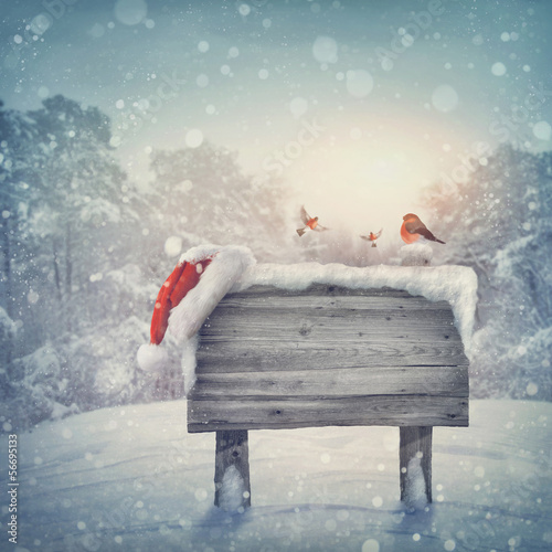 Photo: Wooden sign in winter forest Wooden sign in winter forest