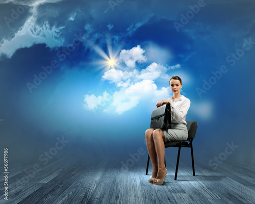 Photo: Businesswoman on chair Businesswoman on chair