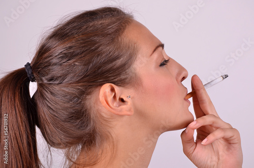 Photo: young woman with cigarette young woman with cigarette