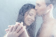 Loving couple in shower. Beautiful loving couple hugging while s Loving couple in shower. Beautiful loving couple hugging while s