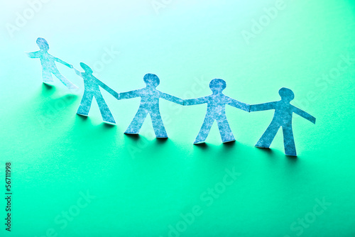 Photo: Paper people in teamworking concept Paper people in teamworking concept