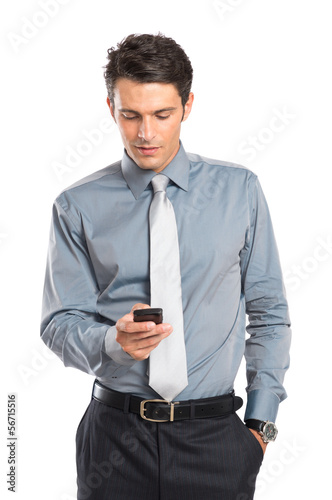 Photo: Businessman Using Cell Phone Businessman Using Cell Phone