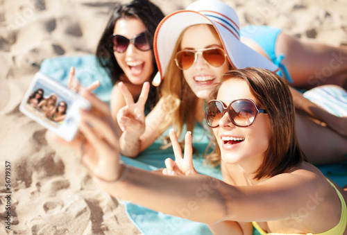 Photo: girls taking self photo on the beach girls taking self photo on the beach