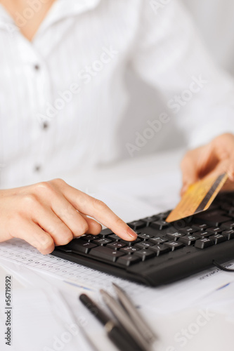 Photo: businesswoman with laptop using credit card businesswoman with laptop using credit card