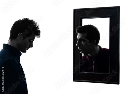 Photo: man in front of his mirror silhouette man in front of his mirror silhouette
