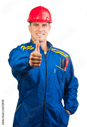 Photo: Handsome mechanic with hard hat and tools Handsome mechanic with hard hat and tools