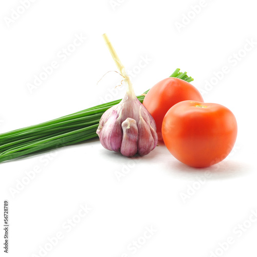 Photo: Mediterranean food ingredients: spring onions, garlic and tomato Mediterranean food ingredients: spring onions, garlic and tomato