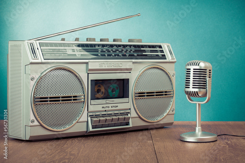 Photo: Retro radio and cassette player, microphone on table Retro radio and cassette player, microphone on table