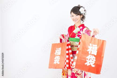 Photo: Beautiful asian kimono woman on white background Beautiful asian kimono woman on white background