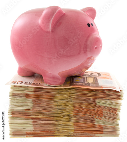 Photo: tirelire "petit cochon rose" sur liasse de billets tirelire "petit cochon rose" sur liasse de billets