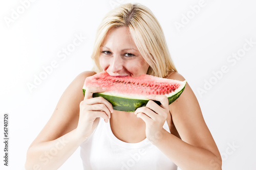 Photo: Happy young woman eating fresh watermelon Happy young woman eating fresh watermelon