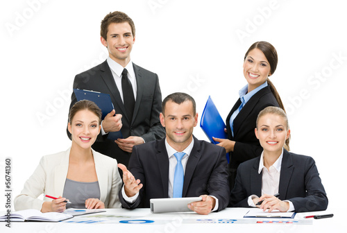 Photo: Group of business people working while sitting at the table Group of business people working while sitting at the table