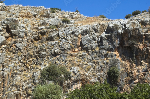 Photo: A rock wall against a blue sky A rock wall against a blue sky