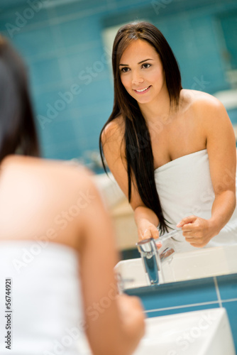 Photo: Woman in the bathroom Woman in the bathroom