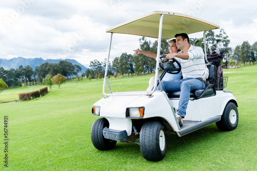 Photo: Players in a golf cart Players in a golf cart