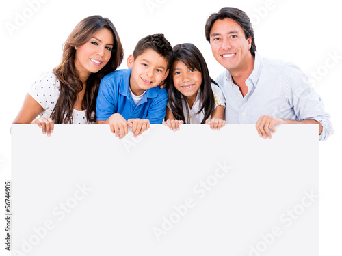 Photo: Happy family with a placard Happy family with a placard