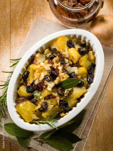 Photo: baked potatoes with dried tomatoes and black olives baked potatoes with dried tomatoes and black olives