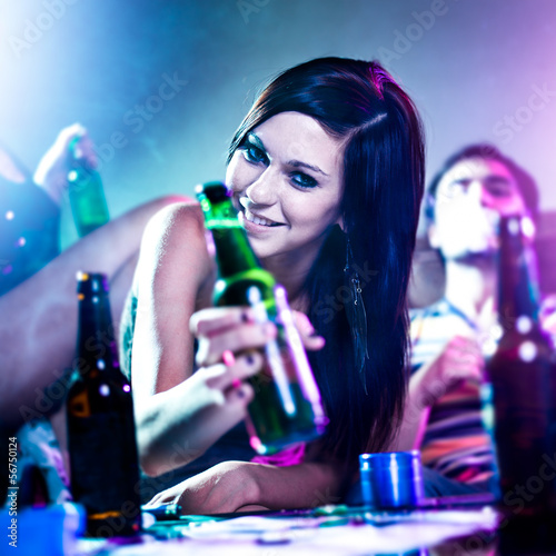 Photo: girl at drug fueled house party with beer bottle. girl at drug fueled house party with beer bottle.
