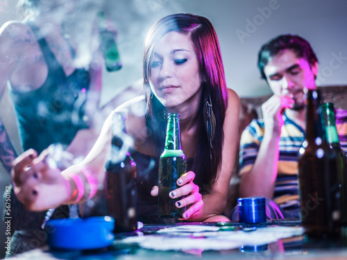 Photo: girl putting joint in ashtray at crazy party girl putting joint in ashtray at crazy party
