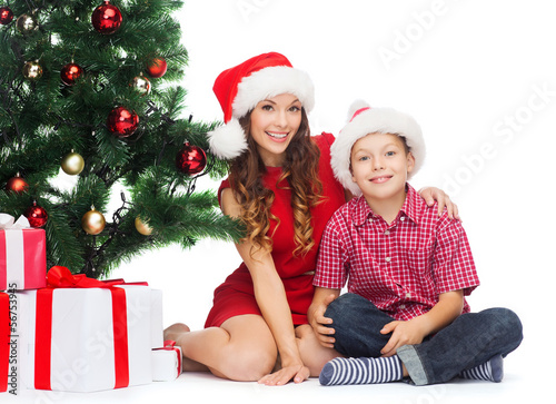 Photo: happy mother and child boy with gift boxes happy mother and child boy with gift boxes
