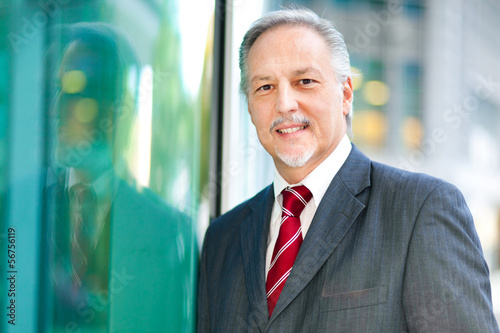 Photo: Smiling businessman portrait Smiling businessman portrait