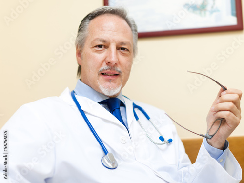 Photo: Smiling doctor in his studio Smiling doctor in his studio