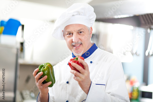 Photo: Chef working in his kitchen Chef working in his kitchen