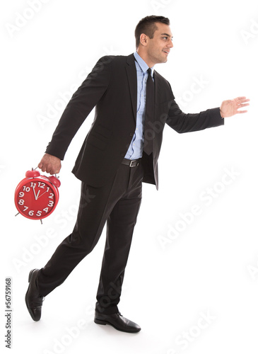 Photo: Manager unter Zeitdruck oder Eile isoliert mit Uhr Manager unter Zeitdruck oder Eile isoliert mit Uhr