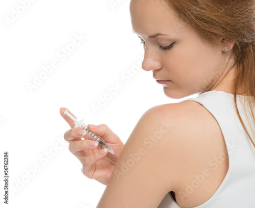 Photo: patient make an arm subcutaneous insulin syringe injection patient make an arm subcutaneous insulin syringe injection