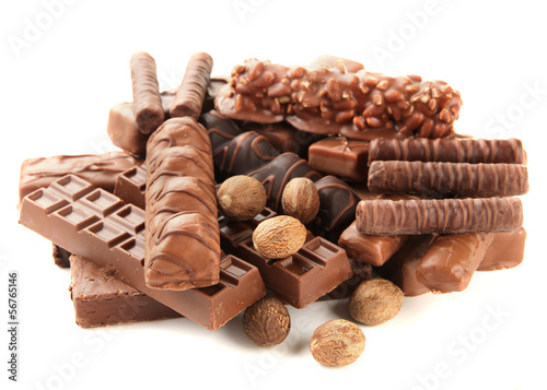 Photo: Delicious chocolate bars with nuts isolated on white Delicious chocolate bars with nuts isolated on white