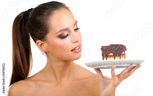 Photo: Portrait of beautiful young girl with chocolate cupcake Portrait of beautiful young girl with chocolate cupcake