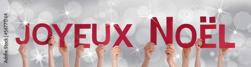 Photo: People Holding Joyeux Noel People Holding Joyeux Noel