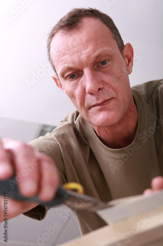 Photo: Craftsman cutting paper Craftsman cutting paper