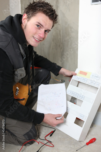 Photo: Electrician with a fuse box Electrician with a fuse box