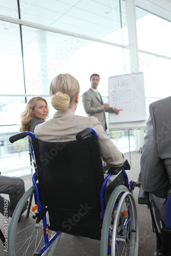 Photo: Woman in a wheelchair at meeting Woman in a wheelchair at meeting