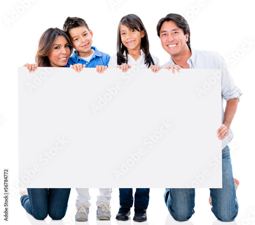 Photo: Happy family with a placard Happy family with a placard