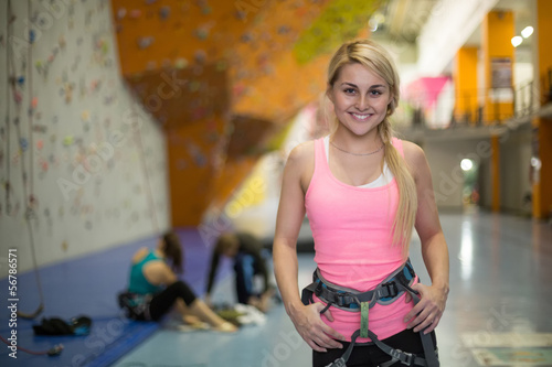 Photo: smiling girl with climbing equipment on climbing gym smiling girl with climbing equipment on climbing gym