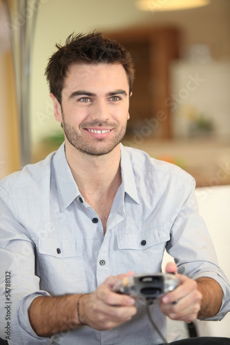 Photo: Man playing video games Man playing video games