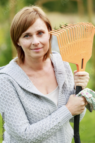 Photo: Gardening - mature woman working in the garden Gardening - mature woman working in the garden