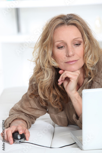Photo: Woman on computer Woman on computer
