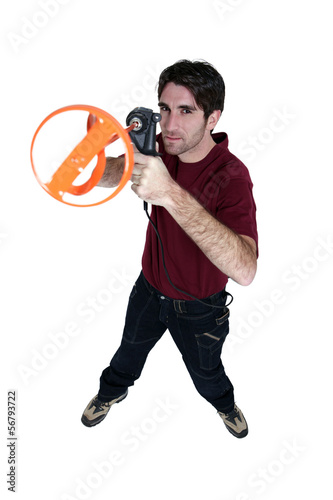 Photo: Man with a paint mixing paddle Man with a paint mixing paddle
