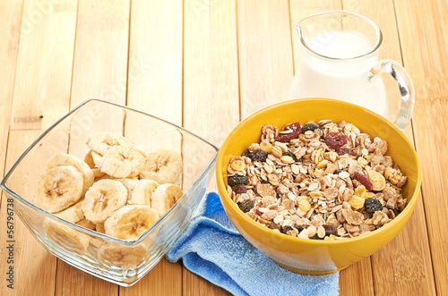 Photo: Delicious and healthy cereal in bowl with milk Delicious and healthy cereal in bowl with milk