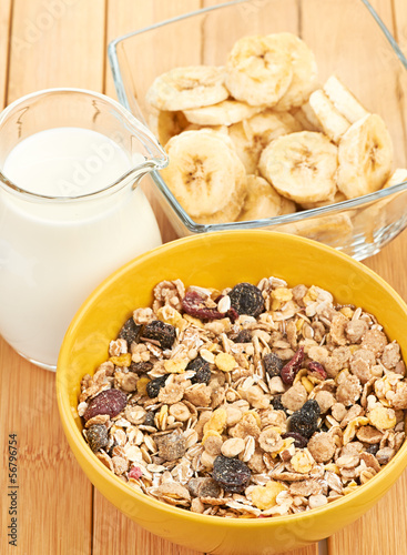 Photo: Delicious and healthy cereal in bowl with milk Delicious and healthy cereal in bowl with milk