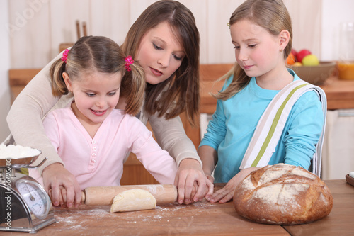 Photo: Mother and daughters baking Mother and daughters baking