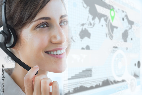 Photo: Cheerful call center employee using futuristic interface hologra Cheerful call center employee using futuristic interface hologra